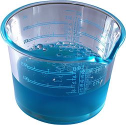 Cup of blue laundry detergent